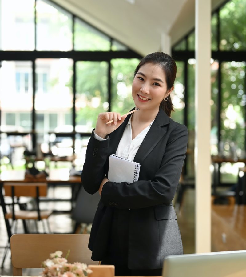 portrait-of-smiling-smart-attractive-young-woman-standing-in-lobby-and-looking-at-camera-.jpg portrait-of-smiling-smart-attractive-young-woman-standing-in-lobby-and-looking-at-camera-.jpg